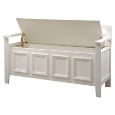 a white wooden bench with four doors on each side and a stuffed animal in the back