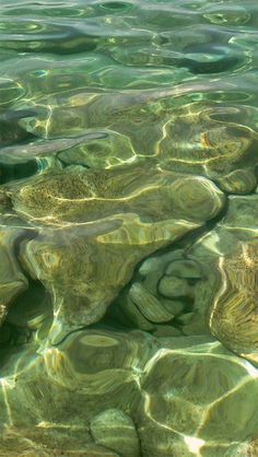 the water is crystal green and clear with little ripples on it's surface