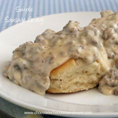 biscuits covered in gravy on a plate