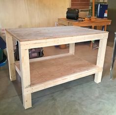 a workbench made out of plywood and wood