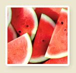 a pile of watermelon slices sitting on top of each other in front of a white frame