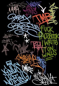 a bunch of graffiti written on the side of a black wall in different colors and sizes