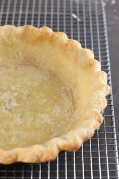 an uncooked pie crust on a cooling rack