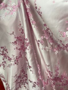 a pink and white floral print fabric