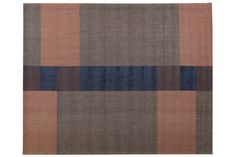 a brown and blue rug with squares on the bottom, in different sizes and colors