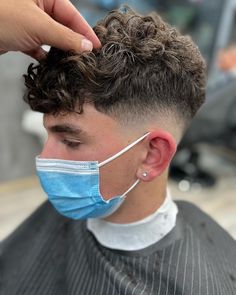 Trendy Men’s Hair, Mid Fade Curly Hair Men, Short Curly Boys Haircut, Mens Perm Fade, Haircut For Curly Hair Boys, Fade Curly Hair Men, Low Fade Curly Hair Men, Curly Hair Fades For Men, Boys Haircut Curly