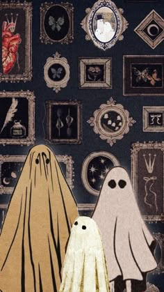 there are two ghost standing next to each other in front of pictures on the wall