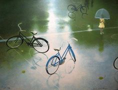 two bicycles and an umbrella on a rainy day