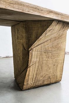 a wooden bench made out of wood with an interesting design on the top and bottom