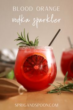 blood orange vodka spritler with rosemary garnish