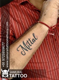 a man with a tattoo on his arm that says, mittal and the word'tatoo '