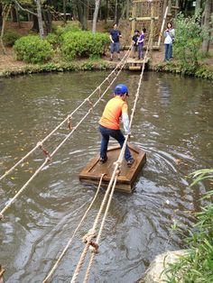 a person on a wooden raft in the water