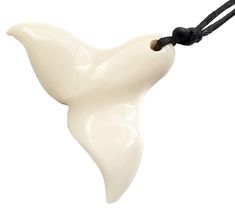 a white porcelain bird on a black cord