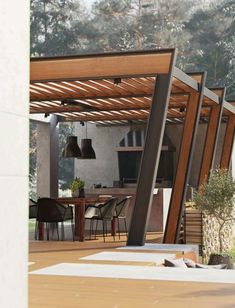 an outdoor dining area with wooden tables and chairs under a pergolated roof, surrounded by greenery