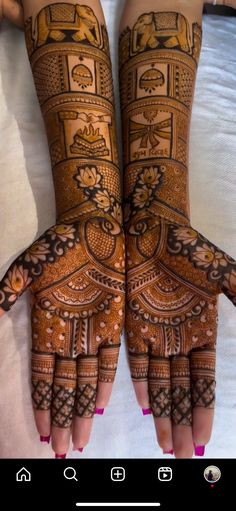 two hands with henna designs on them