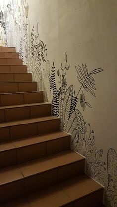 the stairs are painted with black and white flowers