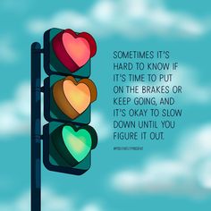 a traffic light with two hearts on it and a quote from the book sometimes it's hard to know if it's time to put on the brakes or keep going, and it's okay to slow down until you