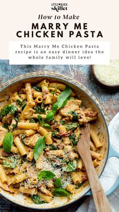 a pan filled with chicken pasta and spinach