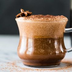 a cup filled with hot chocolate and topped with cinnamon