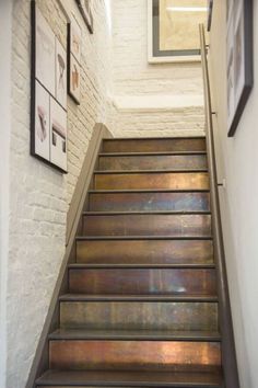 a set of metal steps leading up to a wall