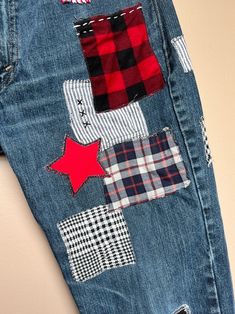 a pair of jeans with patchwork on them