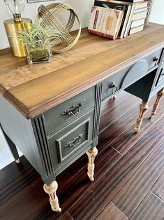 a table with drawers and some books on top