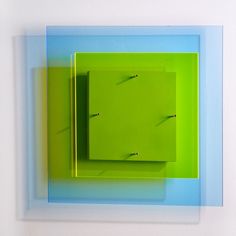 an abstract painting with blue and green squares on the bottom, including one square in the middle