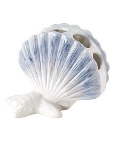 The Avanti abstract coastal toothbrush holder is a figural piece with fan shells front and back, sitting on a starfish base. It is decorated with blue and beige irregular brushstrokes on a white base. Ceramic Toothbrush Holder, Beachy Room, Bathroom Oasis, Beach Icon, Beach Room, Coastal Bathrooms, Shell Design, Beach Bathrooms, Bathroom Accessory Set