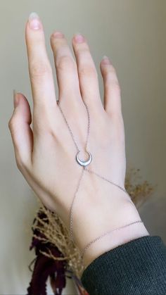 "Silver Hand Chain Bracelet, Dainty Moon Hand Chain Bracelets for Her, Celestial Jewelry, Tiny Moon, Finger Bracelet, Bride and Bridesmaid ★ All chains and metals used in these necklaces, rings, earrings, bracelets are made of 14K, 24K Solid Gold and Silver. Poor quality products are not used (unfilled, not gilded, uncoated) ★ Each order will be beautifully packaged to gift in a jewelry box. Make sure to press \"favorite\" on the right to keep it in your favorite list and/or add it to your wishl Silver Hand Chain, Hand Bracelets, Hand Chain Jewelry, Finger Bracelets, Hand Chain Bracelet, Moon Bracelet, Bracelet Dainty, Handcrafted Bracelets, Chain Bracelets