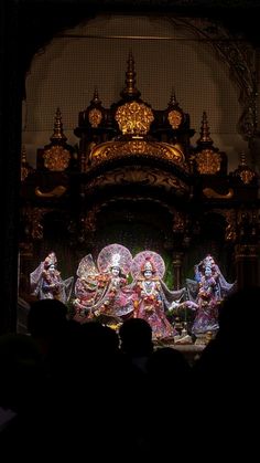 an elaborately decorated stage is shown in the dark