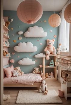 a child's bedroom with teddy bears and clouds on the wall