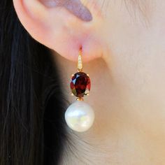 💎 Radiant 14K Solid Gold Natural Fire Red Oval Garnet Diamond Round Baroque Pearls Convertible Drop Earrings *Gemstone:    - Type: Natural Garnet    - Cut: Oval    - Color: Red    - Clarity: Eye-Clean    - Size: 8 x 10 mm    - Total Carat Weight (CTW): 7.40 *Diamonds:    - Color: G    - Clarity: VS    - Total Carat Weight (CTW): 0.05 *Pearls:   - Type: Cultured Round Baroque Pearls   - Size: 12-13 mm *Measurements:    - Length: 1 1/4 inch    - Width: 1/2 inch 🔮 About Garnet: Garnet is celebrat Luxury Red Oval Earrings, Classic Oval Red Earrings, Red Oval Classic Earrings, Classic Red Oval Earrings, Garnet Red, Red Fire, Pearl Size, Red Garnet, Baroque Pearls