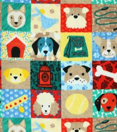 a quilt with dogs on it and some scissors in front of the dog's head