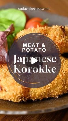 meat and potato japanese korokke on a plate with lettuce, tomatoes, and other vegetables