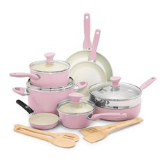 pink pots and pans with wooden utensils on a white background, all in one