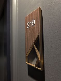 a wooden plaque with the number twenty nine on it