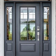 a black double door with two sidelights