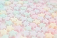 many pastel colored stars are scattered on the ground, and one is blurry