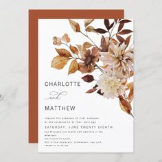 a wedding card with flowers and leaves on it