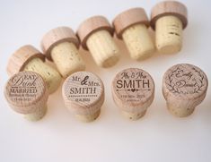 wedding wine corks with names and date printed on them are arranged next to each other