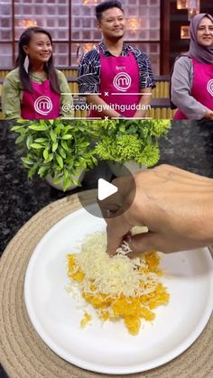 a person cutting up food on top of a white plate