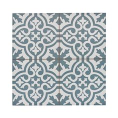 a blue and white tile with an ornate design