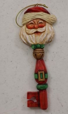 a santa clause ornament hanging on a wall