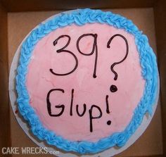 a pink and blue cake with the words 399 glop written on it