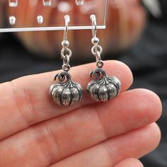 Add a festive touch to your jewelry collection with these delightful pumpkin earrings!  Made with .925 sterling silver and hung from .925 sterling silver ear wires, these pumpkin earrings will add a touch of whimsy to your fall outfits or surprise a friend with this charming gift. Whether you wear them to fall festivals, Thanksgiving gatherings, or Halloween parties, these pumpkin earrings are sure to grab attention. Embrace the spirit of the season and celebrate the magic of autumn with these d Halloween Gift Drop Earrings Jewelry, Halloween Gift Drop Earrings, Halloween Sterling Silver Dangle Earrings, Handmade Sterling Silver Halloween Earrings, Hypoallergenic Drop Earrings For Halloween, Halloween Teardrop Jewelry Gift, Silver Halloween Earrings, Silver Earrings For Halloween Gift, Nickel-free Silver Earrings For Halloween