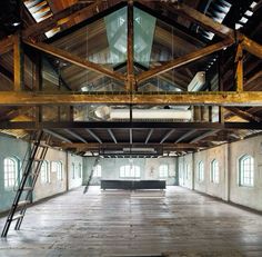 the inside of an old warehouse with exposed ceilings