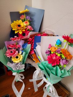 colorful flowers are wrapped in paper and tied together