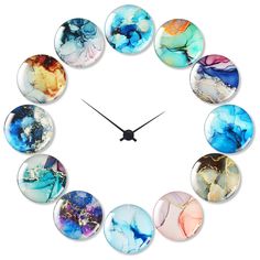 a clock made out of glass with different colors and shapes on the face, in front of a white background