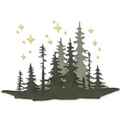 a paper cutout with trees and stars