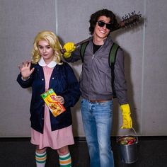 a man and woman dressed up as characters from the movie beetlejuicee, posing for a photo